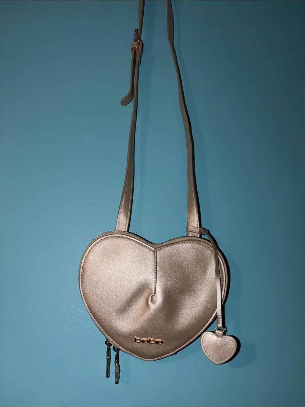 bebe Metallic Champagne Heart Crossbody Bag with Gold Logo